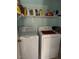 Laundry room with washer, dryer, and overhead shelving at 40047 N Cassara Dr, San Tan Valley, AZ 85140