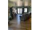 Shot of living room with hardwood floors, patio access, and lots of natural light at 40047 N Cassara Dr, San Tan Valley, AZ 85140