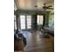 Bright living room with ceiling fan, tile floors, large window, and comfortable seating at 40047 N Cassara Dr, San Tan Valley, AZ 85140