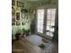Bright living room with wooden floors, large windows, and greenery at 40047 N Cassara Dr, San Tan Valley, AZ 85140