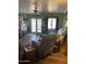 Cozy living room with ceiling fan, tile floors, recliner, and lots of natural light at 40047 N Cassara Dr, San Tan Valley, AZ 85140