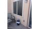 Cozy patio area with chairs, table, and potted plant at 40047 N Cassara Dr, San Tan Valley, AZ 85140