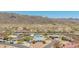 View of a home and backyard featuring a private pool and neighborhood homes at 405 E Thunderbird Trl, Phoenix, AZ 85042