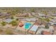 View of a home and backyard featuring a private pool and neighborhood homes at 405 E Thunderbird Trl, Phoenix, AZ 85042