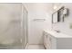 Bathroom with shower, vanity, and ample lighting at 405 E Thunderbird Trl, Phoenix, AZ 85042