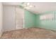 Bedroom with natural light, ceiling fan, and spacious layout at 405 E Thunderbird Trl, Phoenix, AZ 85042
