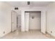 Bedroom with open closet, standard tile flooring, and view to the next room at 405 E Thunderbird Trl, Phoenix, AZ 85042