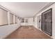 Enclosed patio with multiple windows, tiled flooring, and access to backyard at 405 E Thunderbird Trl, Phoenix, AZ 85042