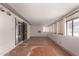 Enclosed patio featuring tiled flooring, multiple windows and view to the outside at 405 E Thunderbird Trl, Phoenix, AZ 85042