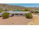 Charming single-story home with desert landscaping and mountain backdrop at 405 E Thunderbird Trl, Phoenix, AZ 85042
