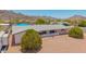 A lovely house features desert landscaping, and mountain views at 405 E Thunderbird Trl, Phoenix, AZ 85042