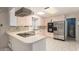 Traditional kitchen equipped with stainless steel appliances and ample counter space at 405 E Thunderbird Trl, Phoenix, AZ 85042