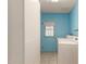 Laundry room with washing machine, dryer, window, and access to the outside at 405 E Thunderbird Trl, Phoenix, AZ 85042