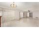 Spacious living room area featuring a vintage chandelier at 405 E Thunderbird Trl, Phoenix, AZ 85042