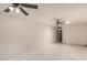 Spacious living room featuring tiled floors and ceiling fans at 405 E Thunderbird Trl, Phoenix, AZ 85042