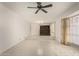 Bright living room with tiled floor and vintage chandelier at 405 E Thunderbird Trl, Phoenix, AZ 85042
