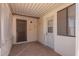 Outdoor patio with tile flooring and security door, and access to backyard at 405 E Thunderbird Trl, Phoenix, AZ 85042
