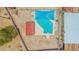 Aerial view of a backyard pool with a sun shade covering with a red covered patio area at 405 E Thunderbird Trl, Phoenix, AZ 85042