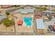 Aerial view of private pool and fenced backyard with patio shade covering at 405 E Thunderbird Trl, Phoenix, AZ 85042