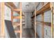 View of the storage area with multiple wooden shelves at 405 E Thunderbird Trl, Phoenix, AZ 85042