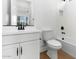 Bathroom with vanity, subway tile, and black fixtures at 4451 N 203Rd Ave, Buckeye, AZ 85396