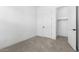 Bedroom with plush carpeting, ensuite bathroom, and walk-in closet at 4451 N 203Rd Ave, Buckeye, AZ 85396