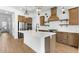 Bright kitchen with stainless steel appliances, a large island, pendant lighting, and custom cabinetry at 4451 N 203Rd Ave, Buckeye, AZ 85396