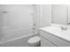 Modern bathroom featuring a bathtub, shower, and a white vanity with a sink at 47204 W Coe St, Maricopa, AZ 85139