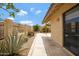 Mature landscaping, stucco fencing and a lush gravel bed create a charming backyard view at 4790 E Navajo St, Phoenix, AZ 85044