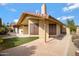 Backyard view features grass lawn, patio, stucco wall and well established landscaping at 4790 E Navajo St, Phoenix, AZ 85044