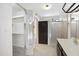 This bathroom offers a walk-in shower, updated vanity with lots of storage and neutral decor at 4790 E Navajo St, Phoenix, AZ 85044