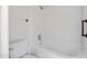A clean and well-lit bathroom featuring a shower and bathtub combination at 4790 E Navajo St, Phoenix, AZ 85044