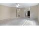 A large open bedroom featuring a ceiling fan, neutral paint, and carpet at 4790 E Navajo St, Phoenix, AZ 85044