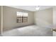 Bedroom with a ceiling fan, large window and neutral paint at 4790 E Navajo St, Phoenix, AZ 85044