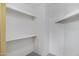 Walk in closet with carpet and ample built in shelving space at 4790 E Navajo St, Phoenix, AZ 85044