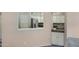 View of white kitchen cabinets and stainless steel refrigerator from the living area at 4790 E Navajo St, Phoenix, AZ 85044