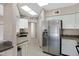 Bright kitchen featuring white cabinets, stainless steel appliances and granite countertops at 4790 E Navajo St, Phoenix, AZ 85044