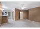 Spacious main bedroom with ensuite bathroom, walk-in closet, and a ceiling fan at 4790 E Navajo St, Phoenix, AZ 85044