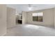 Spacious main bedroom featuring a large window, ceiling fan, neutral tones and an en suite bathroom at 4790 E Navajo St, Phoenix, AZ 85044