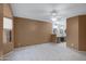 Neutral-toned main bedroom featuring a ceiling fan, large window, and ensuite bath at 4790 E Navajo St, Phoenix, AZ 85044