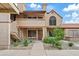 Inviting two-story condo with desert landscaping, a private balcony, and an attractive front door at 4901 E Kelton Ln # 1270, Scottsdale, AZ 85254