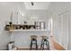 Bright kitchen with white cabinets, a breakfast bar, stainless steel appliances and modern stools at 4901 E Kelton Ln # 1270, Scottsdale, AZ 85254
