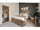 Inviting main bedroom with a wood bed frame, a working desk, and views of other rooms at 4901 E Kelton Ln # 1270, Scottsdale, AZ 85254