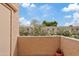 View of the sunny patio featuring textured stucco and verdant plants at 4901 E Kelton Ln # 1270, Scottsdale, AZ 85254