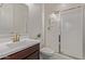 Bathroom showcasing a glass shower with a rain shower head at 5218 N Tiller Dr, Litchfield Park, AZ 85340