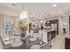 Open-concept dining area with contemporary lighting and stylish decor at 5218 N Tiller Dr, Litchfield Park, AZ 85340