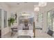 Elegant dining area showcasing a modern chandelier, table setting, and stylish decor at 5218 N Tiller Dr, Litchfield Park, AZ 85340