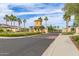 Community entry gate featuring desert landscaping, a guard house, and black wrought iron at 5218 N Tiller Dr, Litchfield Park, AZ 85340