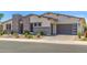 Well-maintained home featuring desert landscaping and a convenient two-car garage at 5218 N Tiller Dr, Litchfield Park, AZ 85340