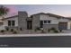 Charming single-story home showcasing stone accents, desert landscaping, and a two-car garage at 5218 N Tiller Dr, Litchfield Park, AZ 85340